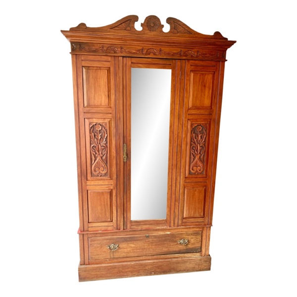 Vintage Armoire with Carved Floral Accents