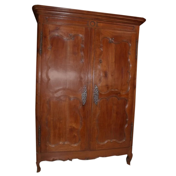 Vintage brown wood armoire with carved details