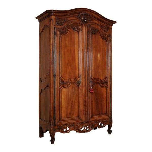 Vintage style wooden armoire with detailed carvings