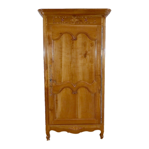 Vintage style wooden armoire with carved details