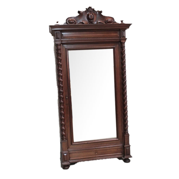 Vintage style dark brown wooden wardrobe with intricate carvings