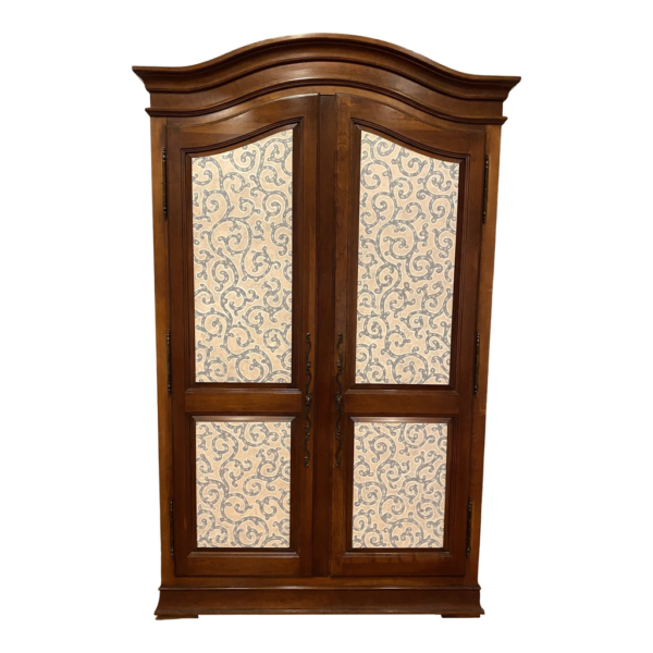 Vintage style wooden armoire with patterned doors