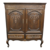 Classic wardrobe with detailed carvings for elegant storage.